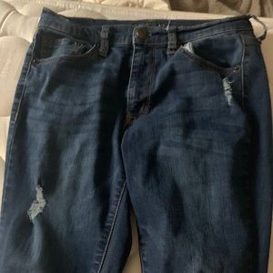 Stressed mid rise skinny jeans